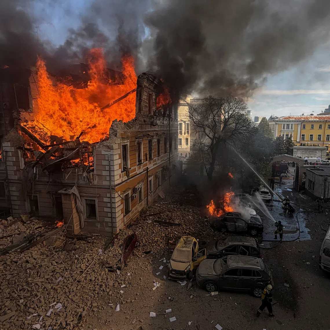 Firefighters attempt to extinguish fire at the site of the Ukraine's Academy of Sciences building hit by a Russian jet-powered drone strike, amid Russia's attack on Ukraine, in Kyiv, Ukraine, September 28, 2026. REUTERS/Sergiy Chalyi