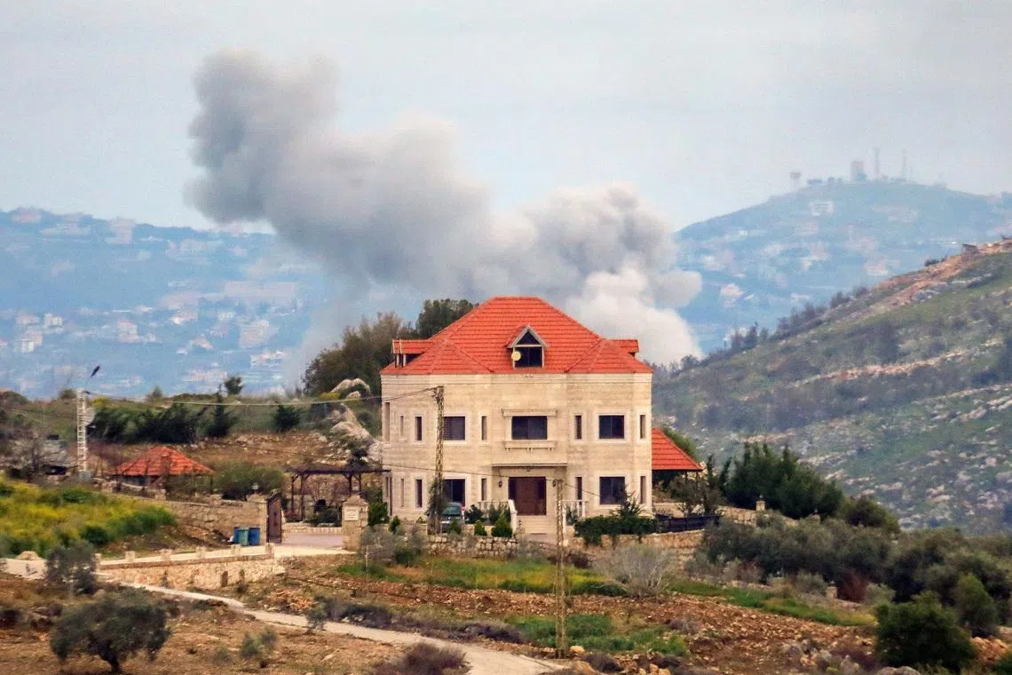 Smoke rises after an Israeli strike, amid escalating hostilities between Israel and Hezbollah, as the U.S.-Israeli conflict with Iran continues, in southern Lebanon, March 25, 2026. REUTERS/Stringer