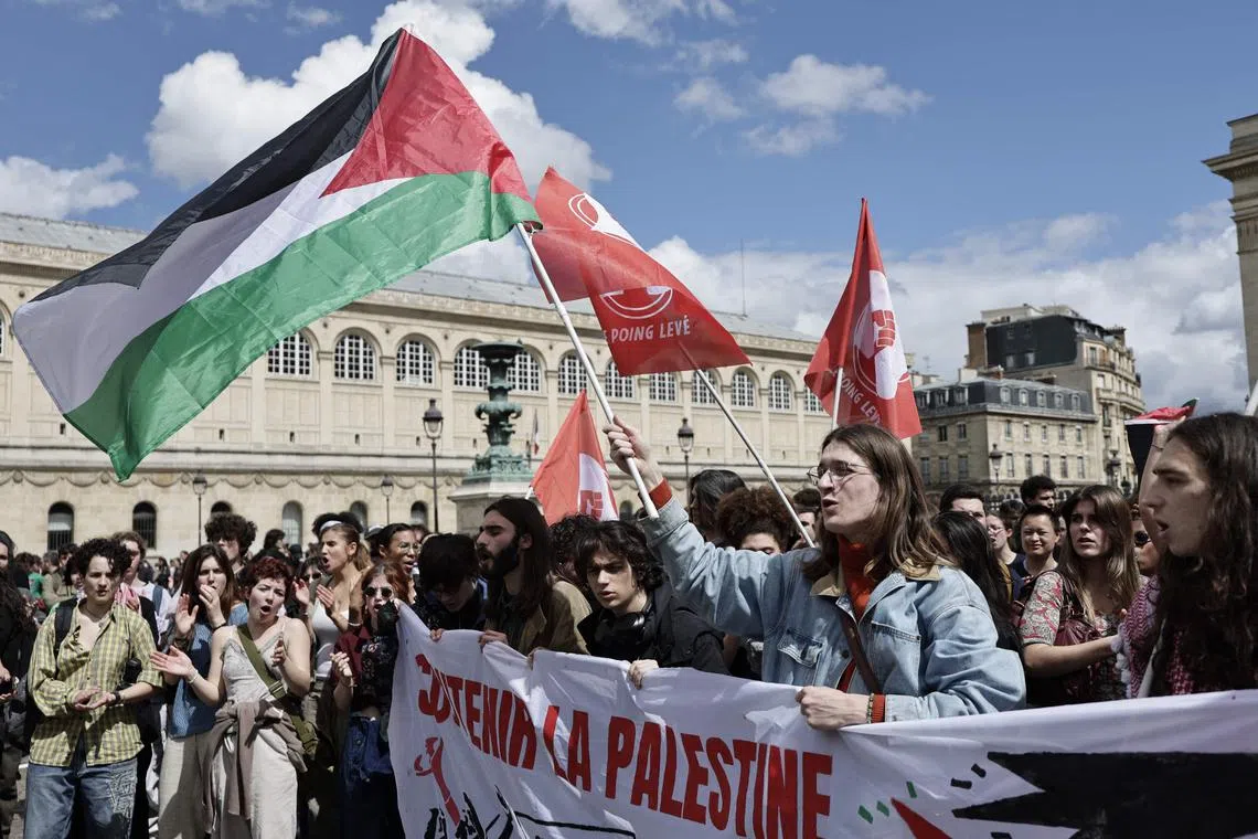 A man waves a Palestinian flag during a demonstration by students of several universities in support of Palestinian people in Paris on May 2, 2024.