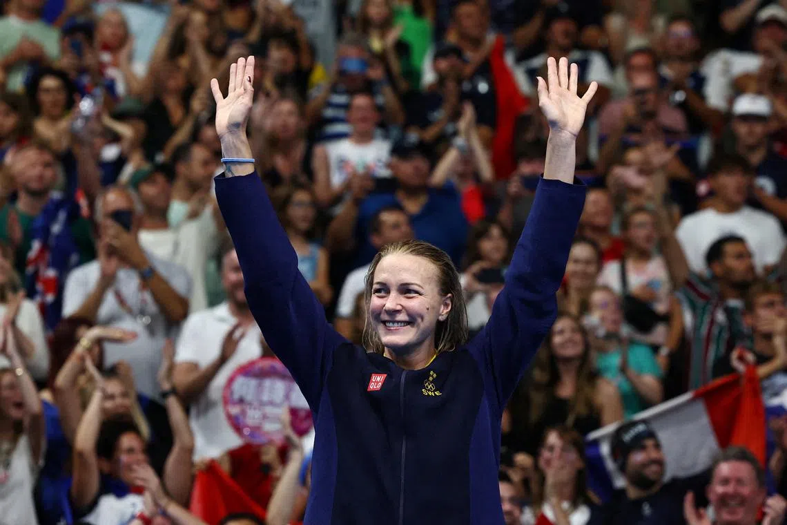 Paris 2024 Olympics - Swimming - Women's 100m Freestyle Victory Ceremony - Paris La Defense Arena, Nanterre, France - July 31, 2024. Gold medallist Sarah Sjostrom of Sweden celebrates on the podium after winning. REUTERS/Evgenia Novozhenina