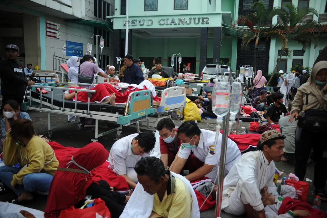 Medical workers treat the victims outside the district hospital after earthquake hit in Cianjur, West Java province, Indonesia, Nov 21, 2022.