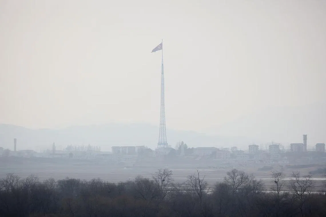 FILE PHOTO: A North Korean flag flutters at the propaganda village of Gijungdong in North Korea, in this picture taken near the truce village of Panmunjom inside the demilitarized zone (DMZ) separating the two Koreas, South Korea, February 7, 2023.   REUTERS/Kim Hong-Ji