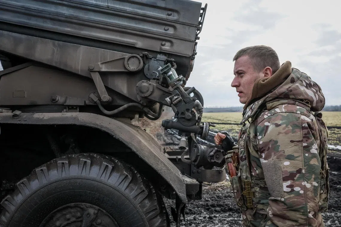 A Ukrainian serviceman prepares to fire a Grad multiple rocket launcher towards Russian troops, in the Donetsk region of Ukraine.