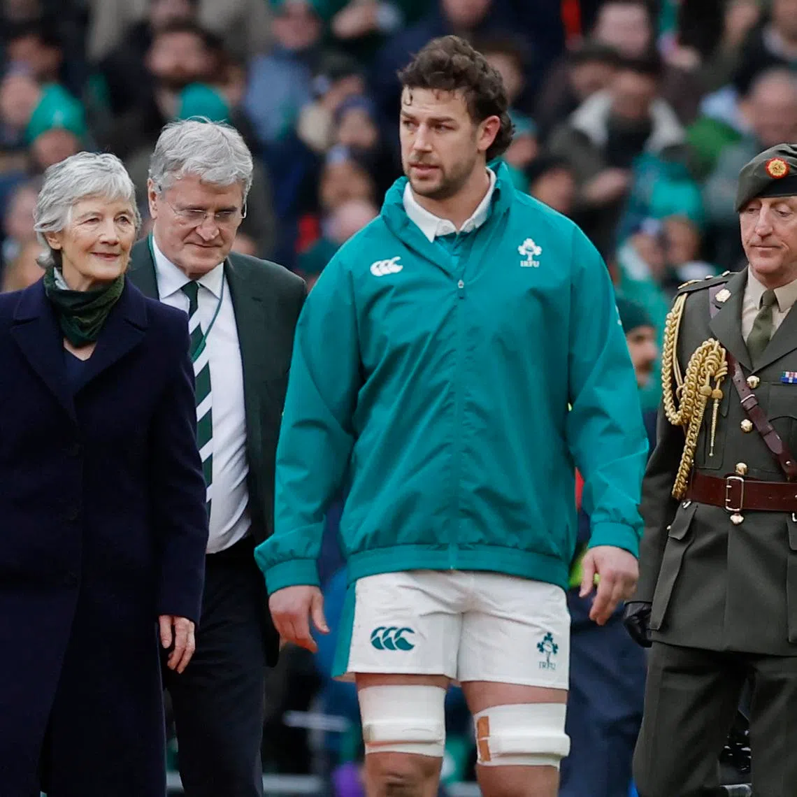 Rugby Union - Six Nations Championship - Ireland v Italy - Aviva Stadium, Dublin, Ireland - February 14, 2026 Ireland's Caelan Doris with President of Ireland Catherine Connolly and President of the Irish Rugby Football Union John O'Driscoll REUTERS/Clodagh Kilcoyne