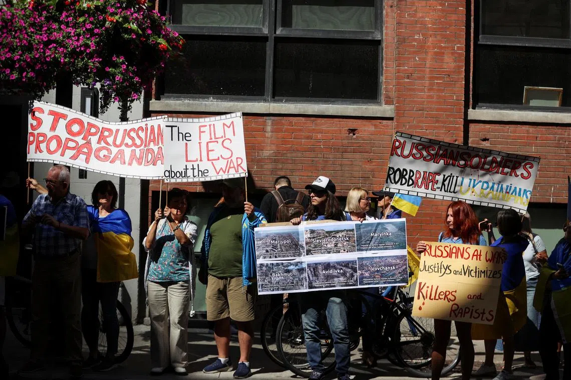 Protesters gather outside the Toronto International Film Festival (TIFF) screening of 'Russians at War', a documentary about Russian troops fighting in Ukraine, in Toronto, Ontario, Canada September 10, 2024. REUTERS/Carlos Osorio