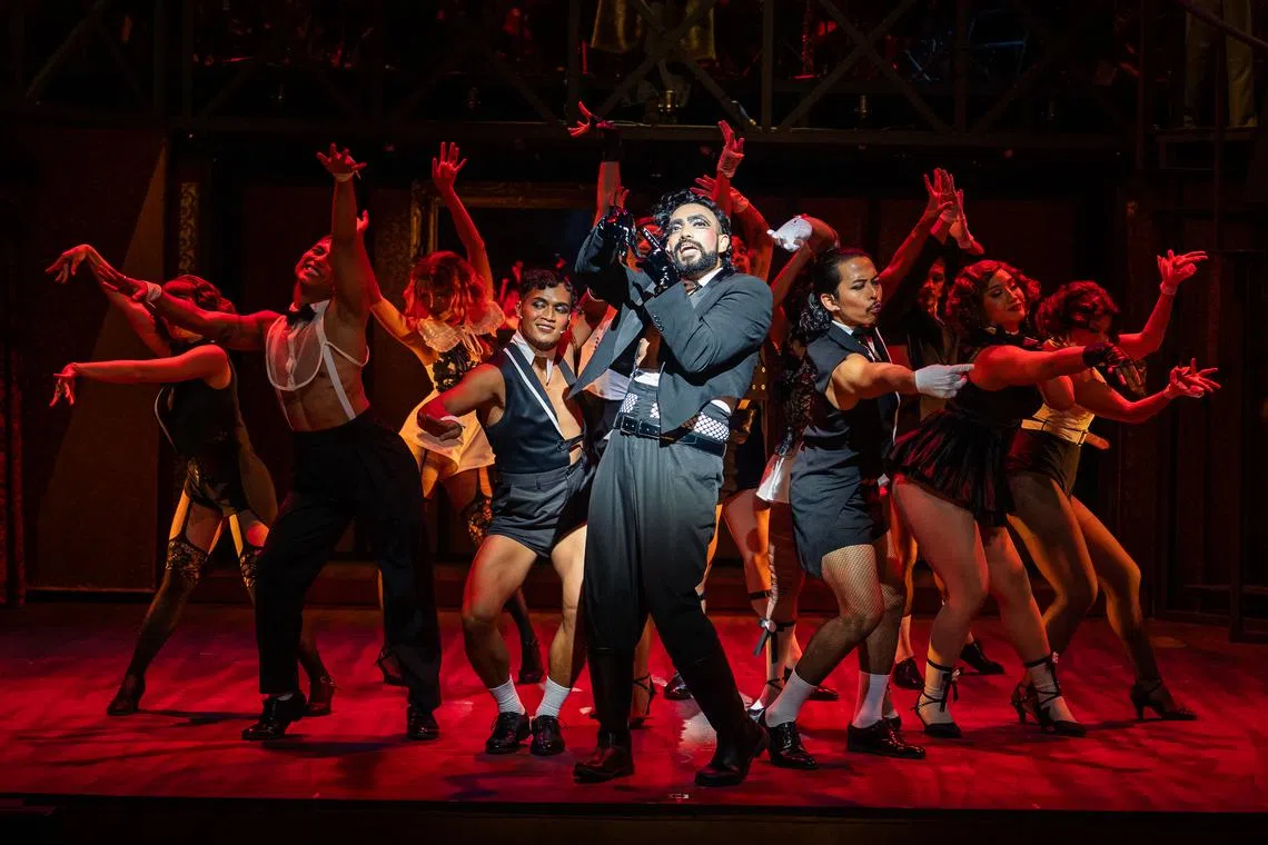 The Emcee (centre - Dwayne Lau) opens the show with "Willkommen," welcoming audiences in a variety of languages while introducing them to the Kit Kat Klub in Berlin.