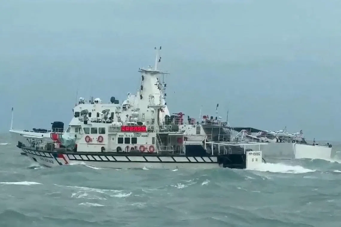 This handout photo taken and released by the Taiwan Coast Guard on April 1 shows a Taiwan Coast Guard ship (front) and a Chinese Coast Guard ship (back) sailing in waters off the Matsu Islands in Taiwan. 