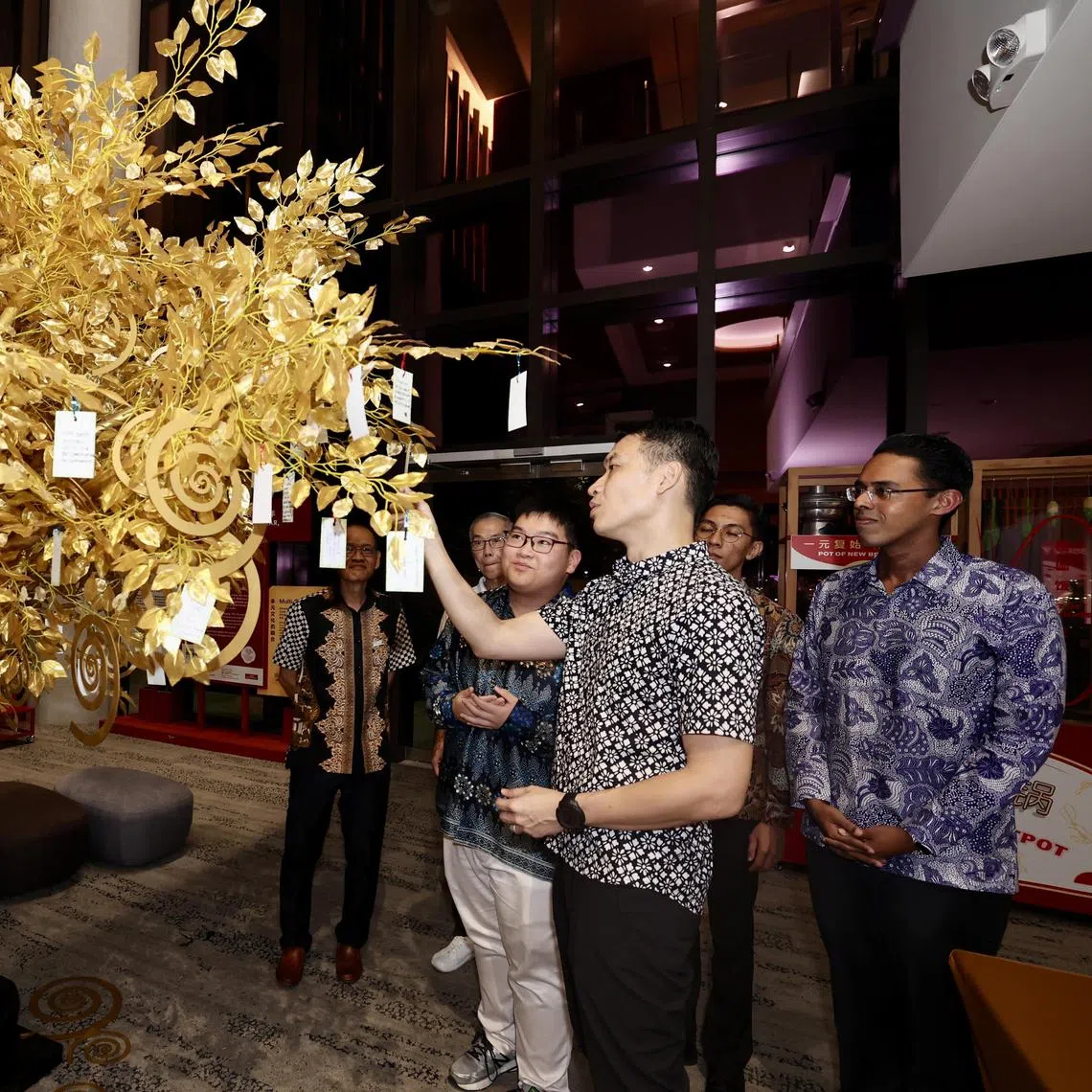 Acting Minister for Culture, Community and Youth David Neochecking out a Harmony Tree bearing people’s wishes for racial harmony atKaleidoscope: Harmony In Motion on July 27. 