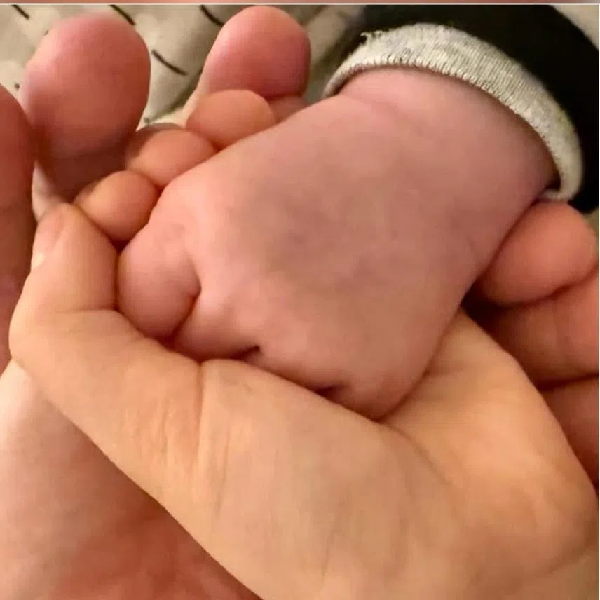 Leo Ku (left) with his wife Lorraine Chan and their son Kuson in a photo on social media in May 2025. He announces the birth of his second child on social media on Jan 1.