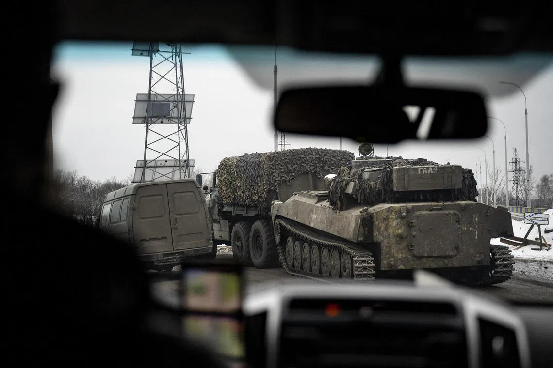 A self-propelled howitzer is towed near the front line in Ukraine's Donbas region, on Jan 31, 2023.