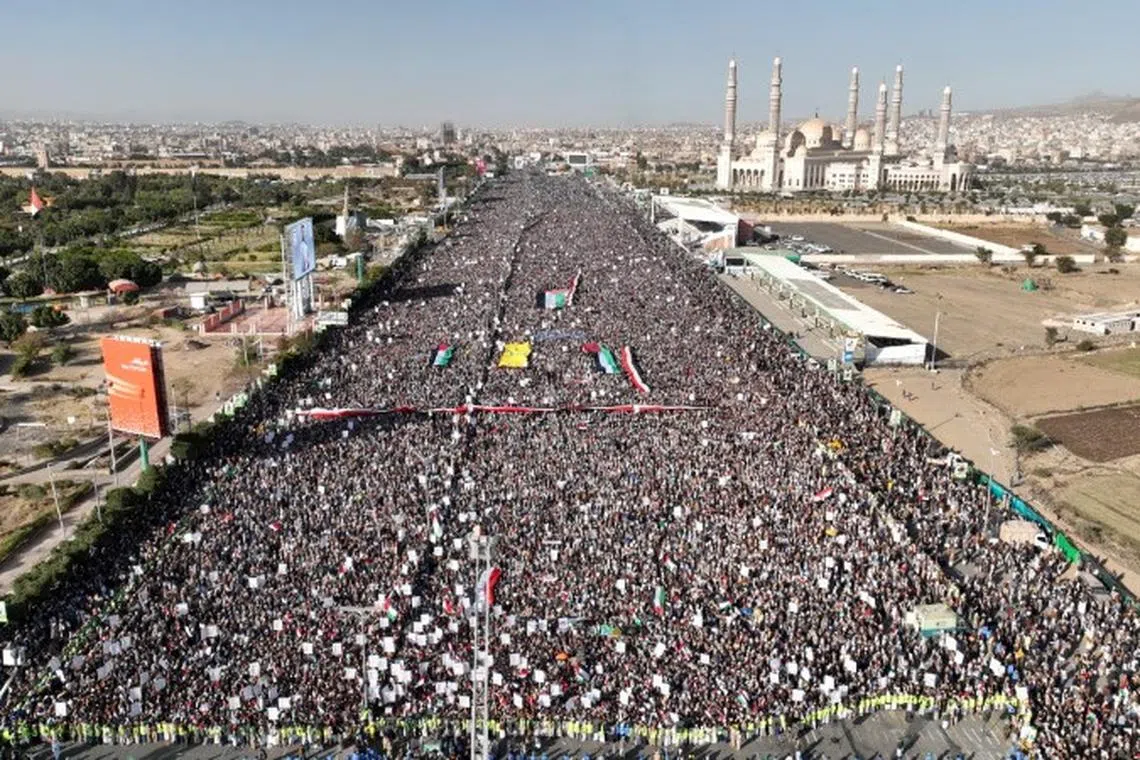 FILE PHOTO: A drone view as Houthi movement supporters rally to denounce air strikes launched by the U.S. and Britain on Houthi targets, in Sanaa, Yemen January 12, 2024. Houth Media Center/Handout via REUTERS/File Photo