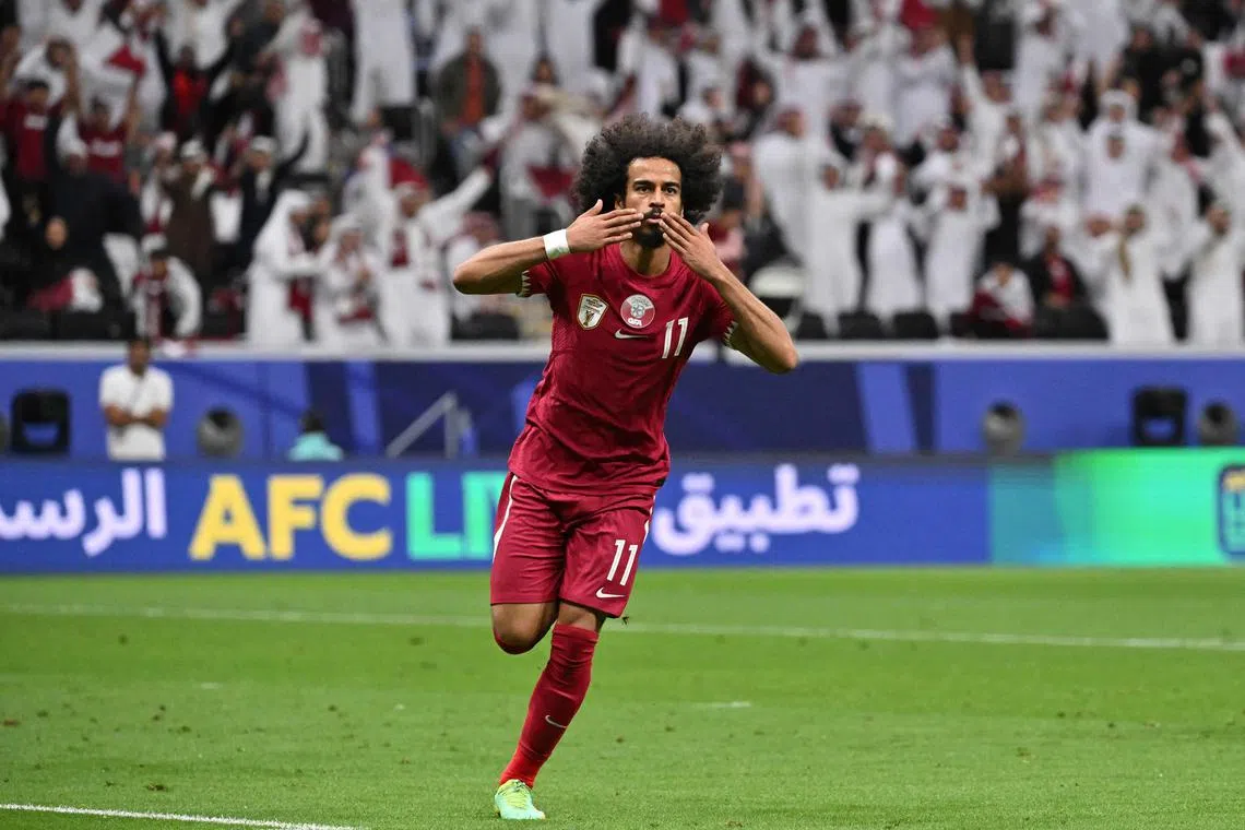 Qatar forward Akram Afif celebrates after scoring his team's first goal during the Qatar 2023 AFC Asian Cup Group A football match between Tajikistan and Qatar at the Al-Bayt Stadium in Al Khor, north of Doha on January 17, 2024. (Photo by HECTOR RETAMAL / AFP)