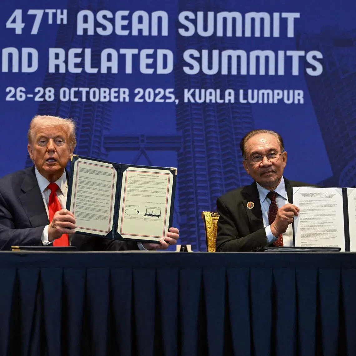 US President Donald Trump and Malaysian Prime Minister Anwar Ibrahim after signing a critical minerals deal in Kuala Lumpur on Oct 26.
