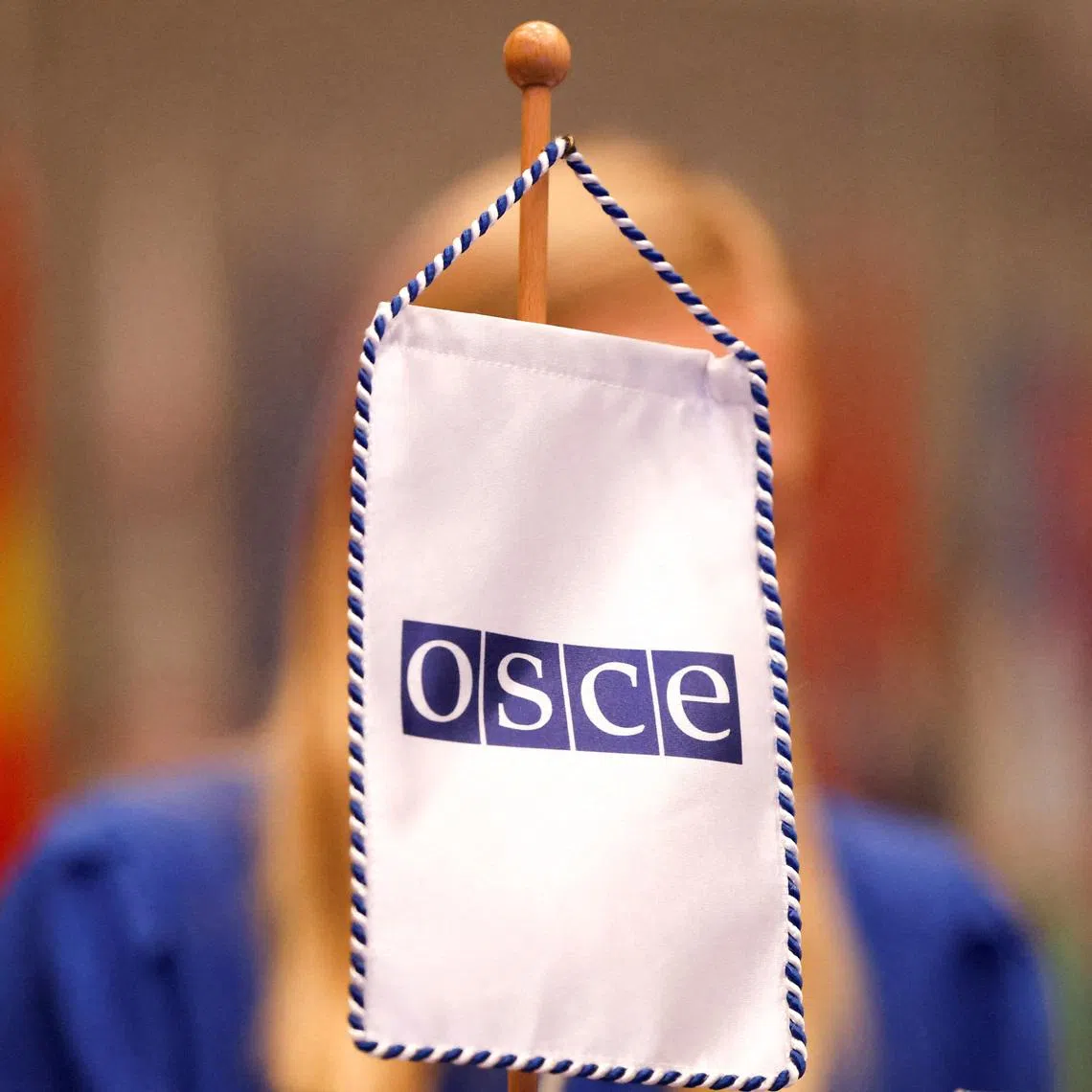 FILE PHOTO: An Organization for Security and Co-operation in Europe (OSCE) sign is pictured as Finnish Foreign Minister and OSCE Chairperson-in-Office Elina Valtonen presents a programme for OSCE 2025 Chairpersonship in Vienna, Austria, January 23, 2025. REUTERS/Lisa Leutner/File Photo