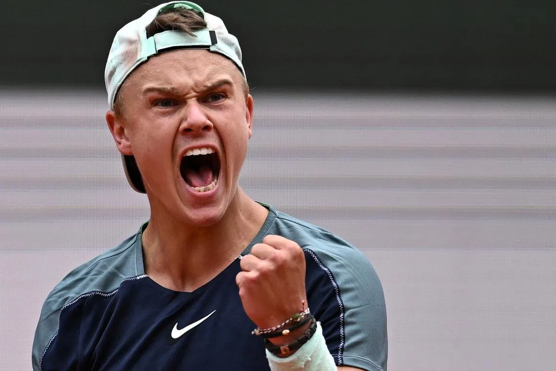 FILE PHOTO: Tennis - French Open - Roland Garros, Paris, France - May 30, 2022  Denmark's Holger Rune reacts during his fourth round match against Greece's Stefanos Tsitsipas REUTERS/Dylan Martinez/File Photo