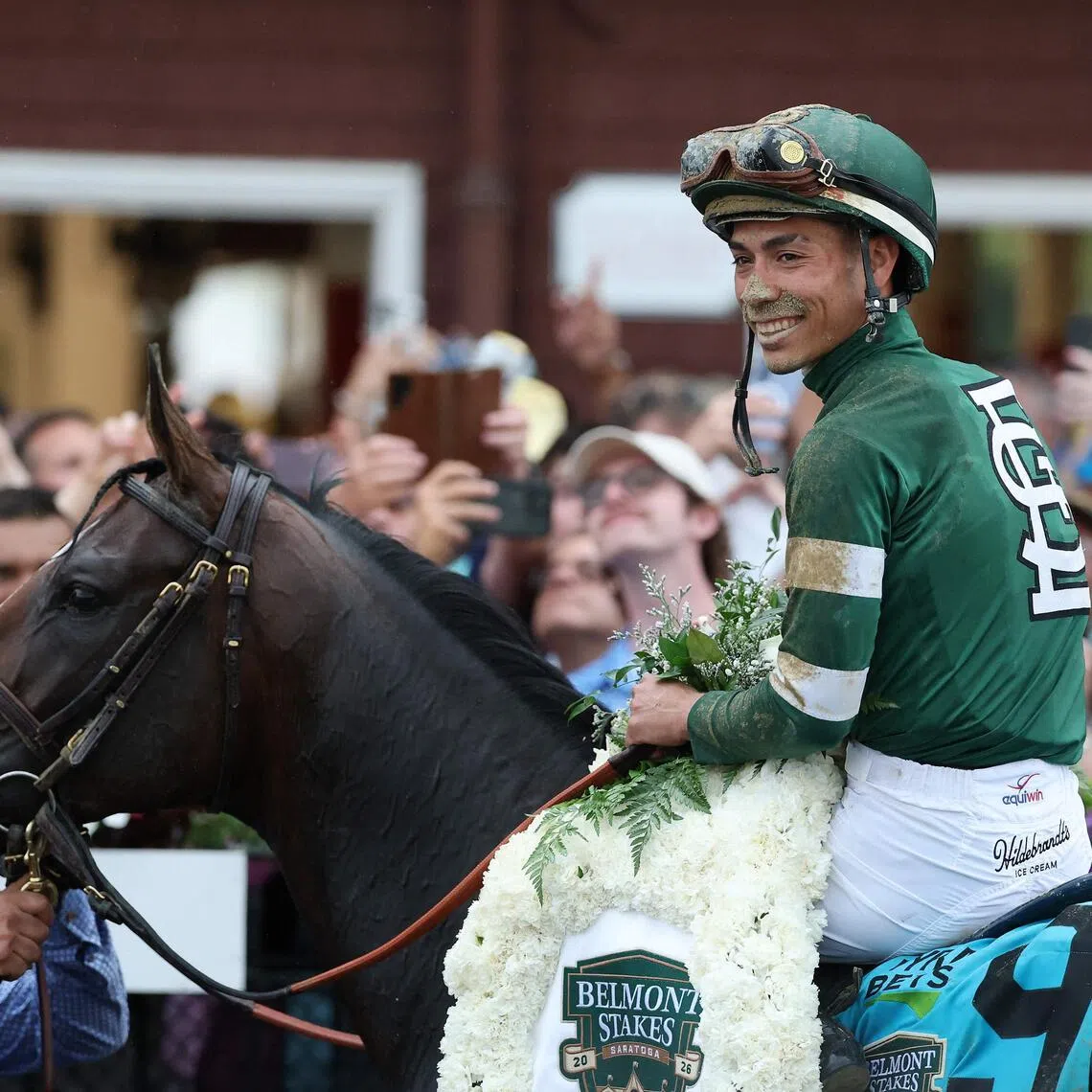 SARATOGA SPRINGS, NEW YORK - JUNE 06: Jose Ortiz atop Golden Tempo celebrates winning the 158th running of the Belmont Stakes at Saratoga Race Course on June 06, 2026 in Saratoga Springs, New York.   Al Bello/Getty Images/AFP (Photo by AL BELLO / GETTY IMAGES NORTH AMERICA / Getty Images via AFP)
