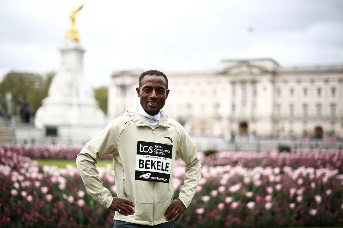 Ethiopia's Kenenisa Bekele poses for pictures in front of Buckingham Palace, as he prepares for the 2024 London Marathon.