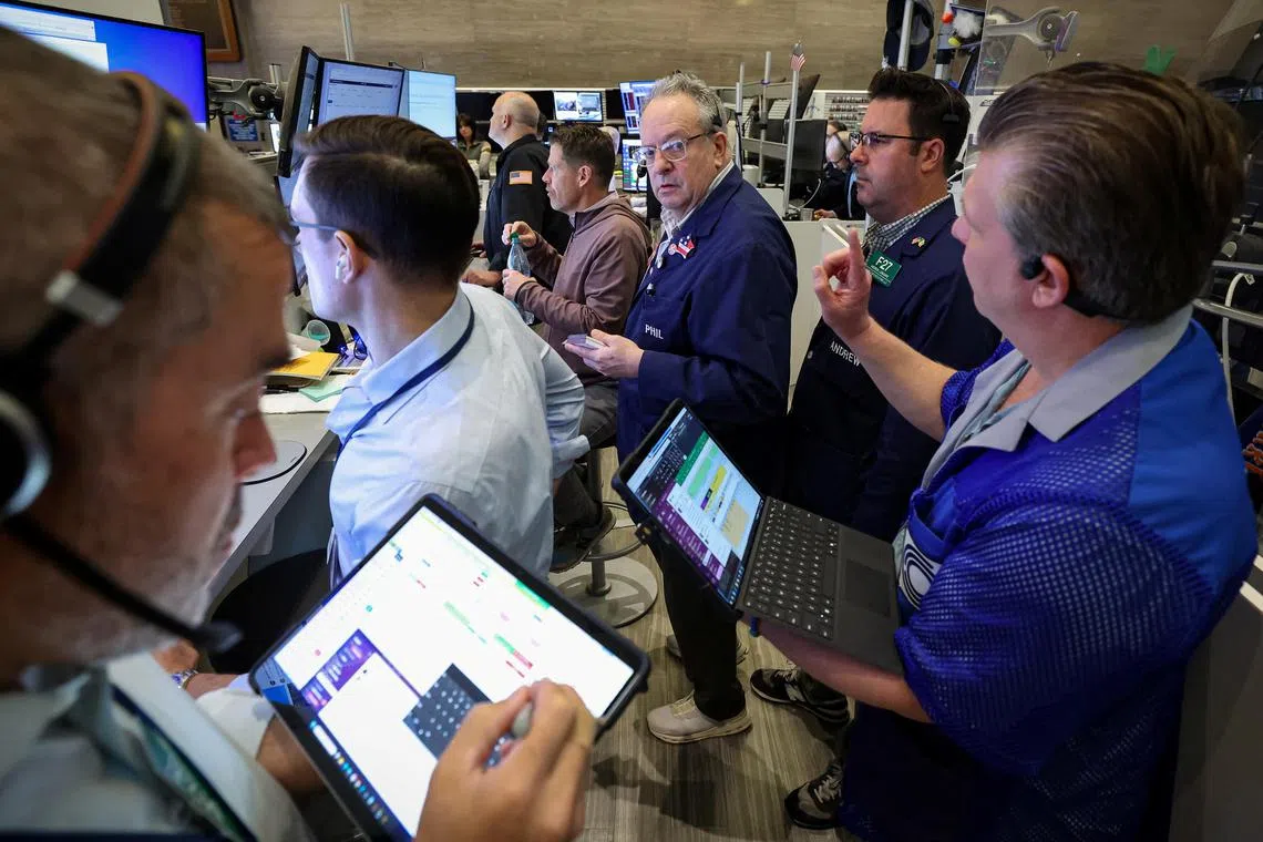 Futures-options traders work at the New York Stock Exchange on April 30.