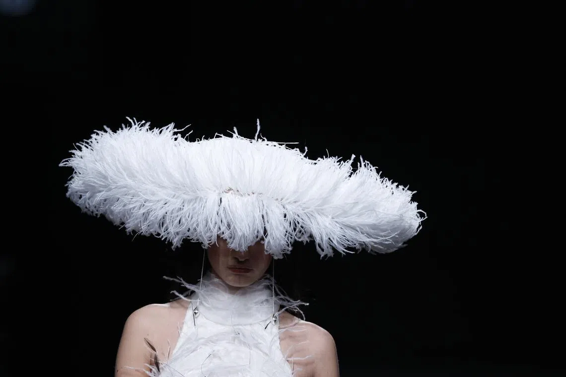 A model displaying a creation from the Autumn/Winter 2025/2026 collection of Claro Couture during the Mercedes Benz Fashion Week Madrid, at IFEMA convention center in Madrid, Spain, on Feb 20, 2025. 