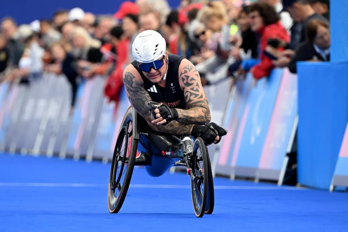 David Weir of Britain reacts after finishing the marathon at the Paris Paralympics, his last event at international level.