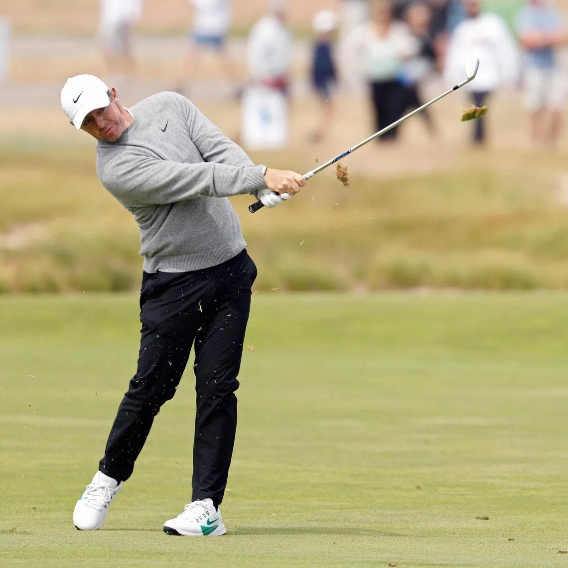 Rory McIlroy of Northern Ireland plays a shot on the eighth hole during the first round of the 126th US Open.