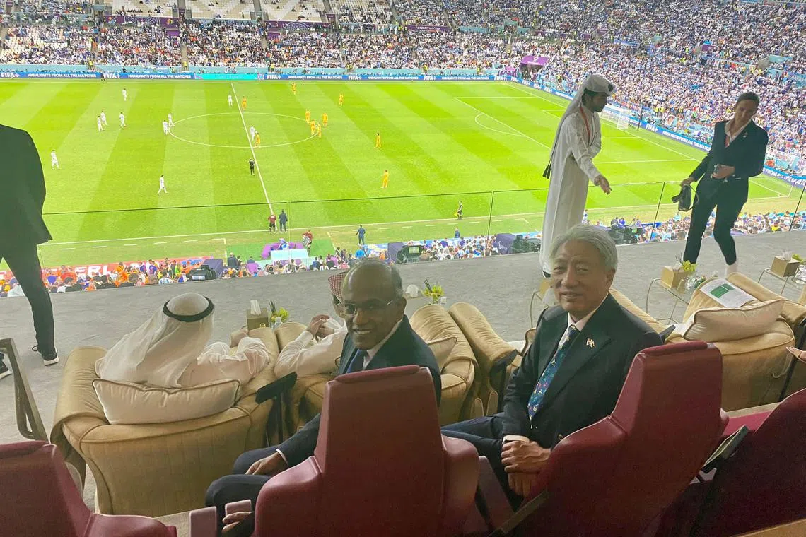 Minister for Home Affairs and Law K. Shanmugam and Senior Minister Teo Chee Hean at the World Cup quarter-final match between Argentina and the Netherlands.