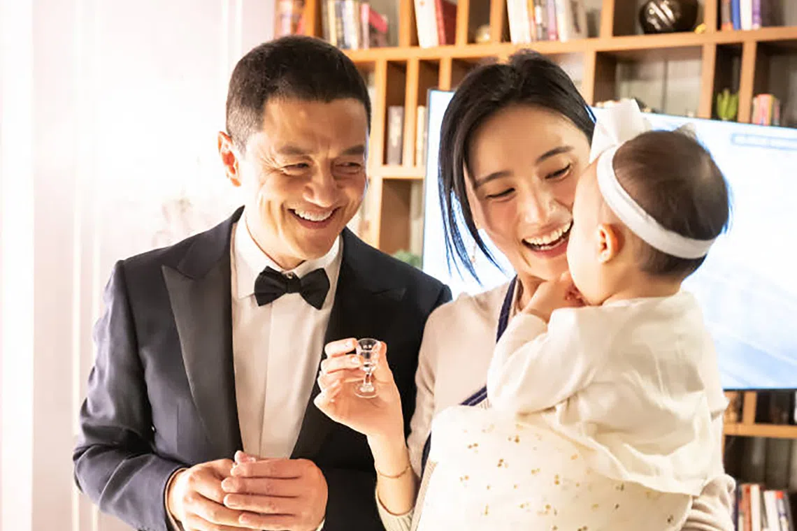 Former Chinese actor Li Yapeng, with former Chinese beauty queen Haiha Jinxi and their daughter Li Xia in happier times.