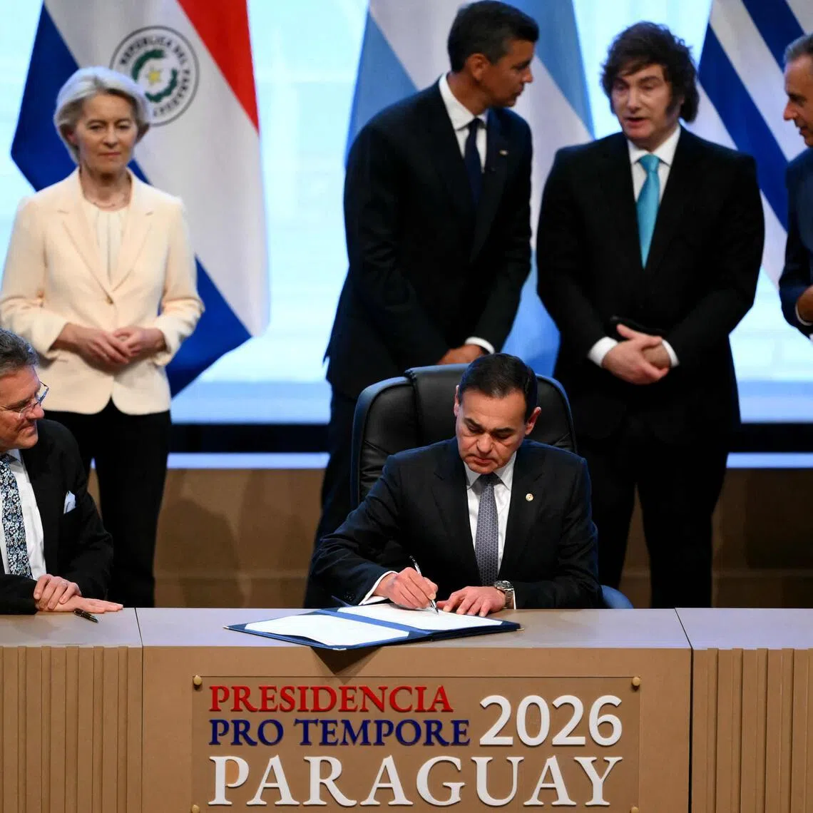 Paraguay's Foreign Minister, Mr Ruben Ramirez Lezcano, signing the document on Jan 17, next to European Commissioner for Trade and Economic Security Maros Sefcovic. Looking on are (from left) European Council president Antonio Costa, European Commission president Ursula von der Leyen, Paraguay President Santiago Pena, Argentina President Javier Milei and Uruguay President Yamandu Orsi.