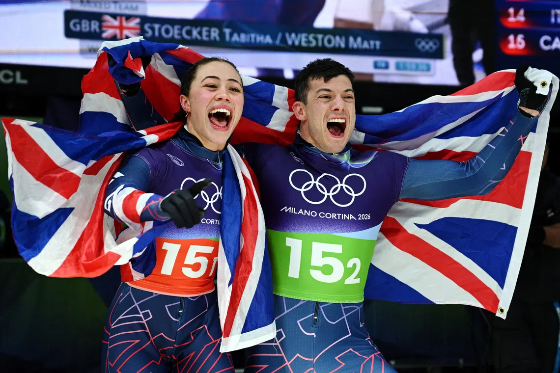 FILE PHOTO: Milano Cortina 2026 Olympics - Skeleton - Mixed Team - Cortina Sliding Centre, Cortina d'Ampezzo, Italy - February 15, 2026. Tabitha Stoecker of Britain and Matt Weston of Britain celebrate after winning the gold medal in the Skeleton Mixed Team. REUTERS/Annegret Hilse/File Photo