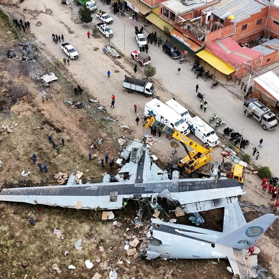 A drone view shows the site where a Bolivian Air Force Hercules aircraft crashed onto a busy avenue amid inclement weather in El Alto, Bolivia, on Feb 28.