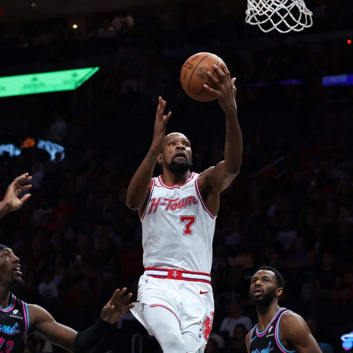 Houston Rockets forward Kevin Durant drives to the basket against Miami Heat centre Bam Adebayo and forward Andrew Wiggins during the second quarter at Kaseya Center.