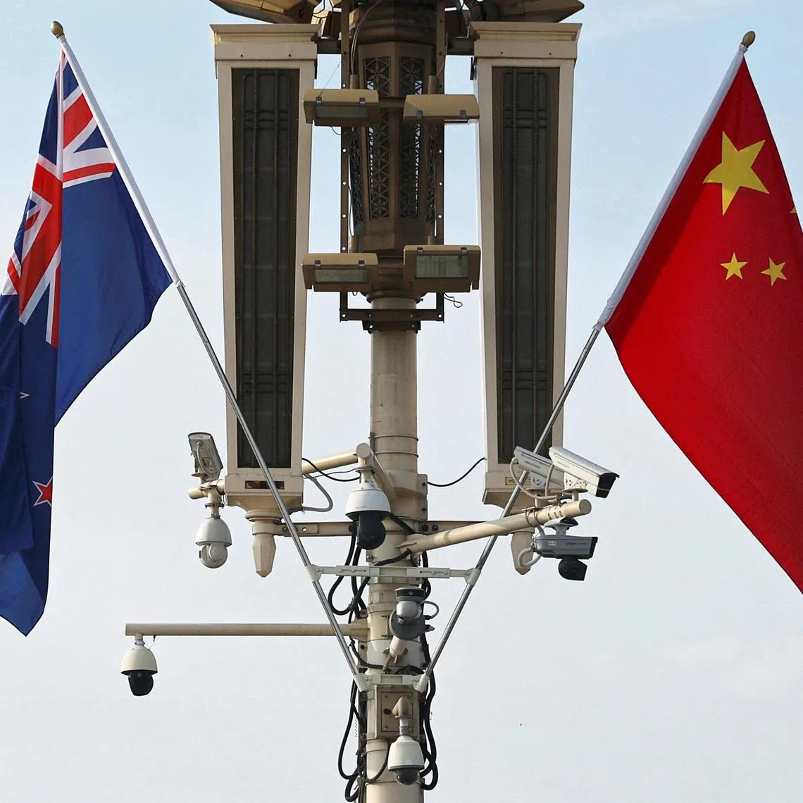 FILE PHOTO: Flags of New Zealand and China flutter near the Tiananmen Gate during New Zealand Prime Minister Christopher Luxon's visit, in Beijing, China June 19, 2025. REUTERS/Florence Lo/File Photo