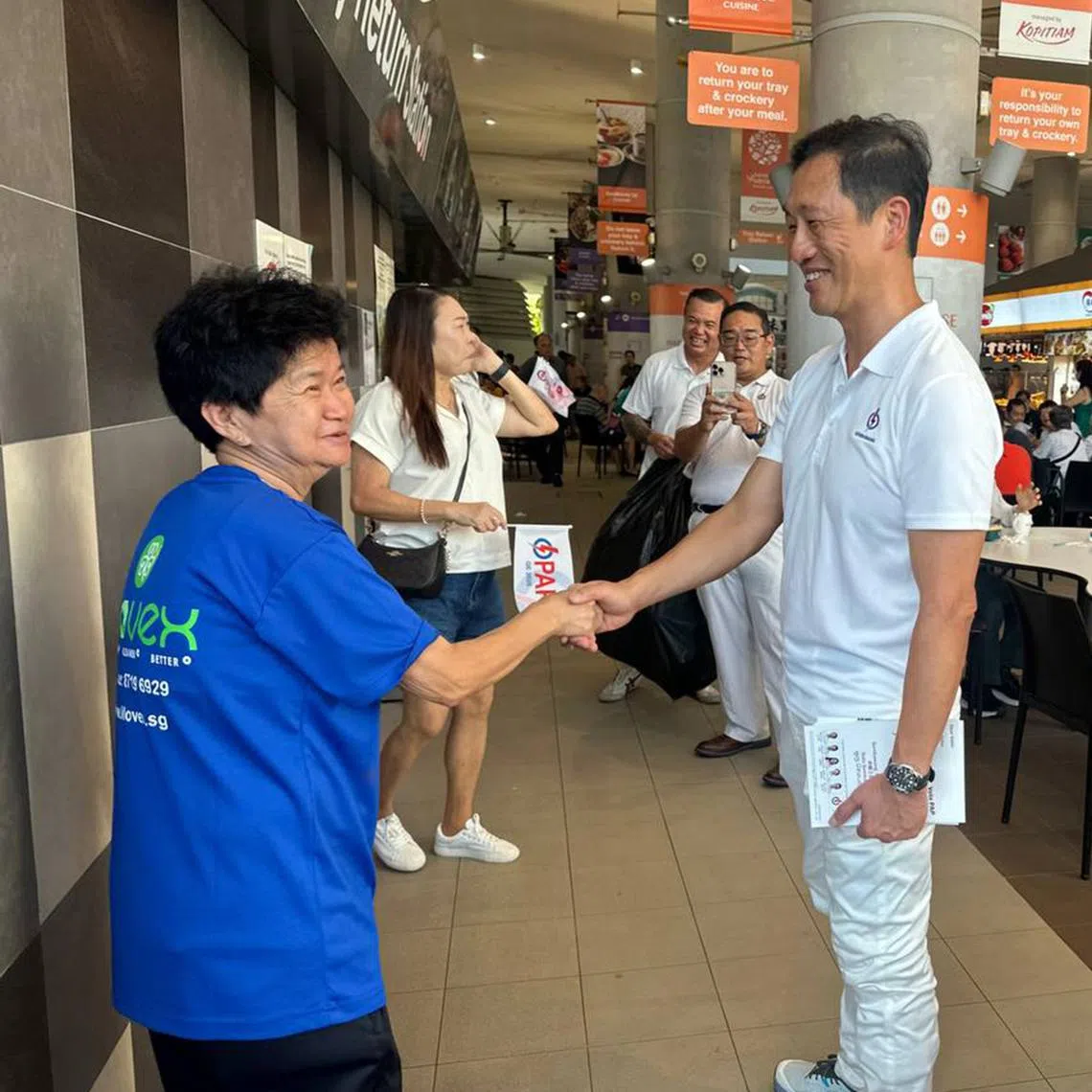 Health Minister Ong Ye Kung greeting a resident during a walkabout at Kampung Admiralty Hawker Centre on April 27.