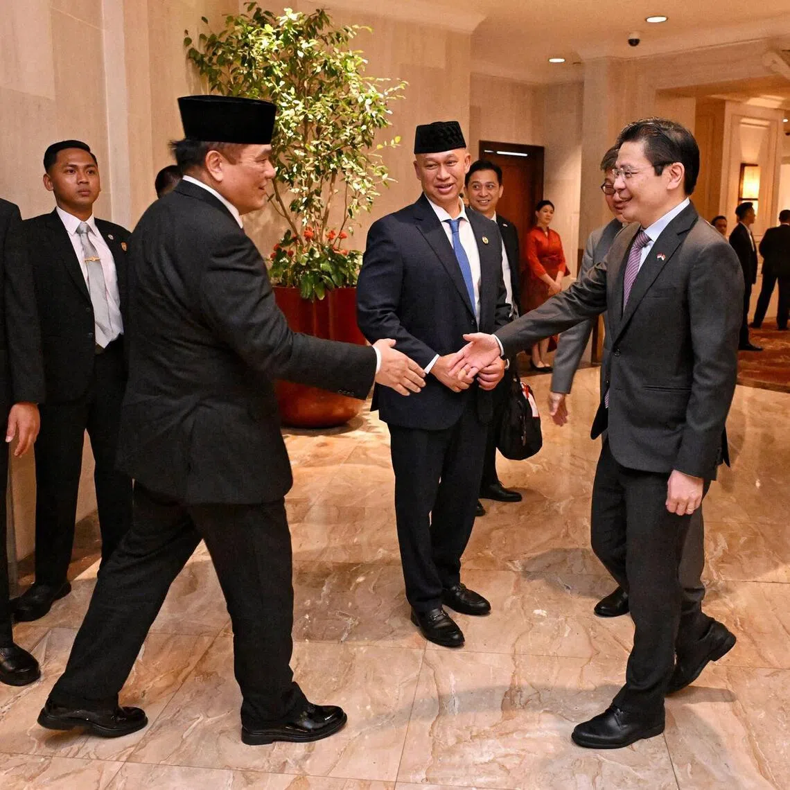 Prime Minister Lawrence Wong (right) meeting Hotmangaradja Pandjaitan, Indonesia’s Ambassador to Singapore, at the Shangri-La Jakarta on July 5, ahead of the Singapore-Indonesia Leaders’ Retreat in the Indonesian capital.