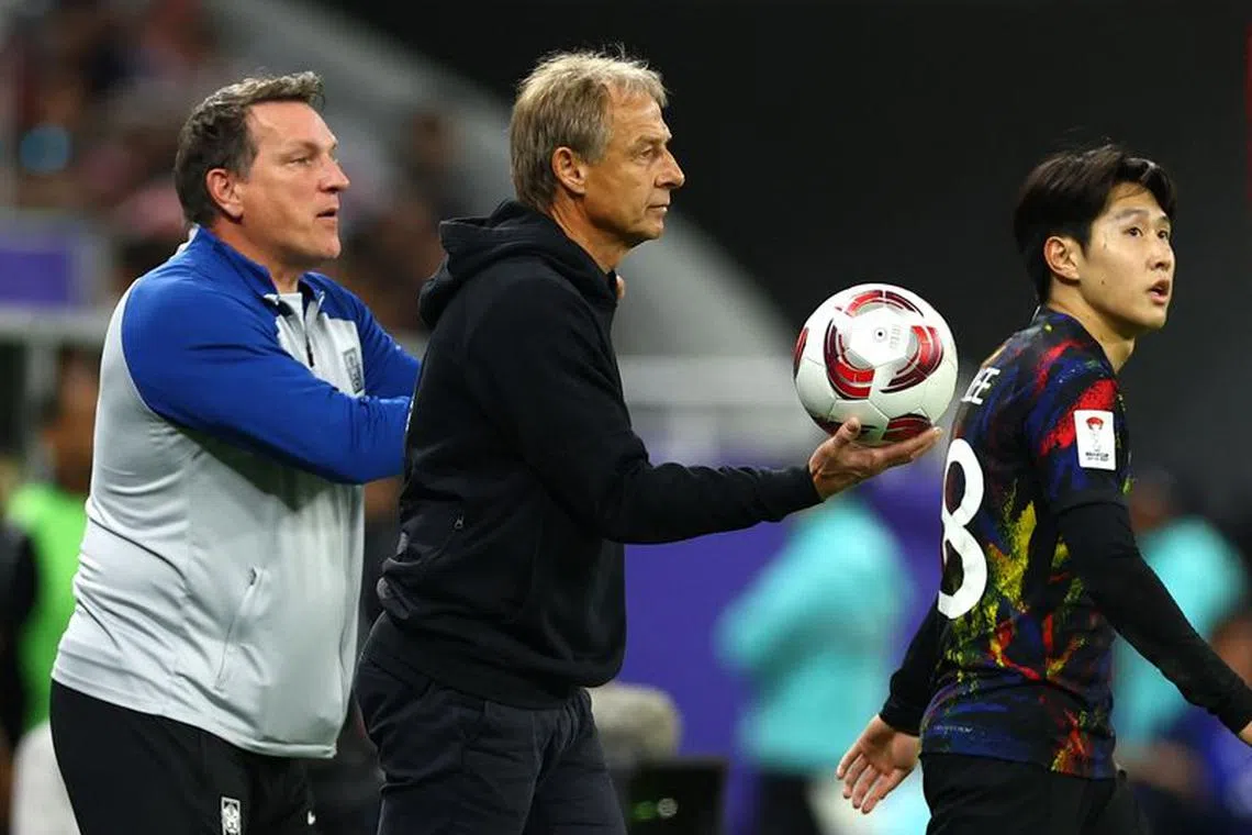 Soccer Football - AFC Asian Cup - Semi Final - Jordan v South Korea - Ahmed bin Ali Stadium, Al Rayyan, Qatar - February 6, 2024 South Korea coach Jurgen Klinsmann holds the match ball REUTERS/Molly Darlington/ File Photo