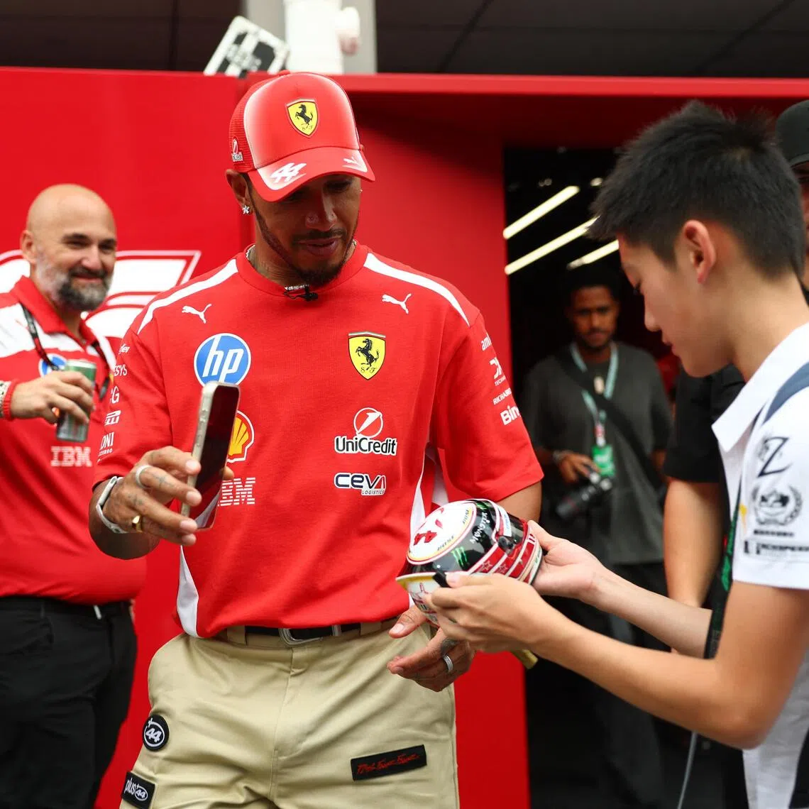 Ferrari’s Lewis Hamilton interacts with fans ahead of the Singapore Grand Prix  on Oct 8.