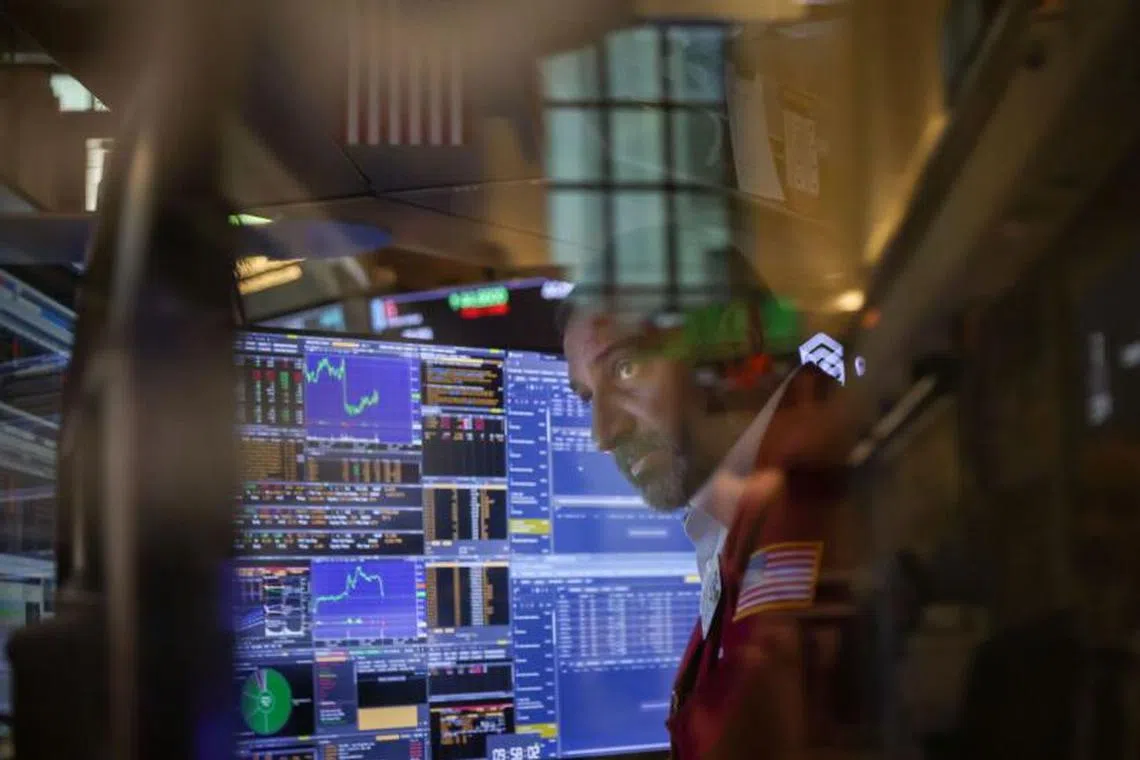 A trader works on the floor at the New York Stock Exchange on Sept 8.