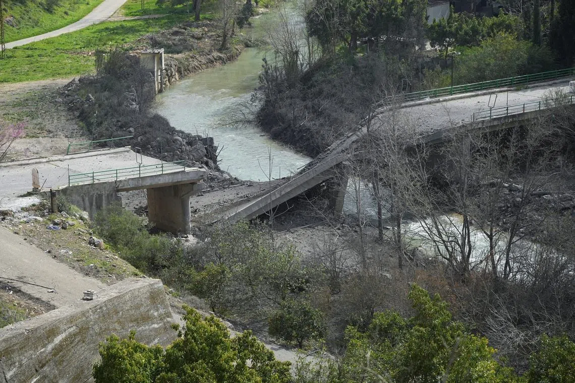 The damaged Zrarieh Bridge over the Litani river, after it was hit by an Israeli strike in Tayr Falsay in southern Lebanon, following an escalation between Hezbollah and Israel amid the U.S.-Israeli conflict with Iran, Lebanon, March 13, 2026. REUTERS/ Stringer