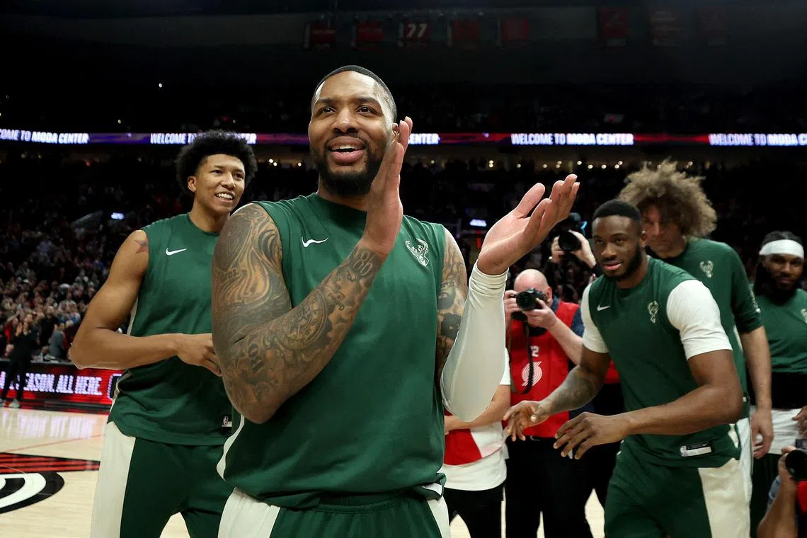 Damian Lillard of the Milwaukee Bucks acknowledges the crowd in his return against the Portland Trail Blazers at Moda Centre.