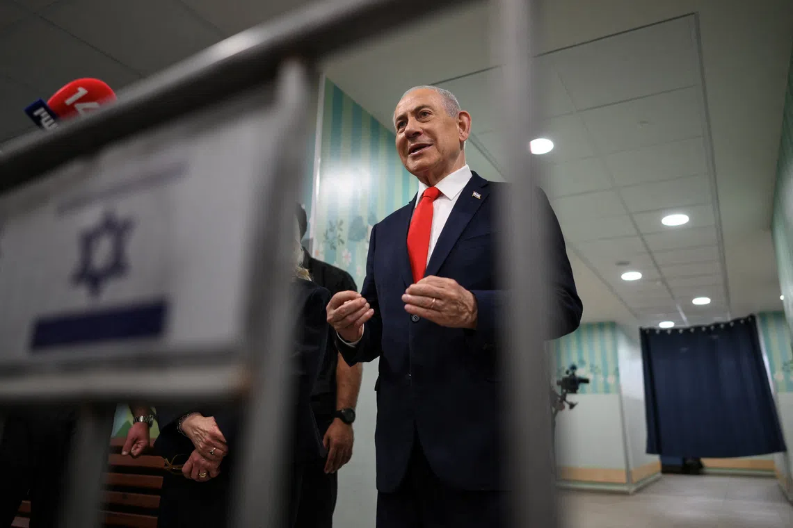 Israel's Prime Minister Benjamin Netanyahu speaks to the media after voting at a polling station in Jerusalem, Israel, on the day of Israel's legislative election, October 27, 2026. Jewel Samad/Pool via REUTERS