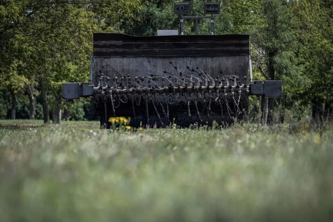 A demining device, mounted on an excavator and capable of detonating anti-personnel and anti-tank mines, is tested, amid Russia&#039;s attack on Ukraine, near Kryvyi Rih, Zaporizhzhia region, Ukraine August 12, 2023. REUTERS/Viacheslav Ratynskyi/File Photo