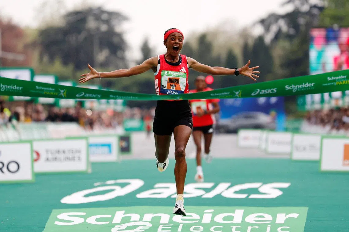 Athletics - Paris Marathon - Paris, France - April 13, 2025 Ethiopia's Bedatu Hirpa celebrates winning the women's race REUTERS/Stephanie Lecocq     TPX IMAGES OF THE DAY
