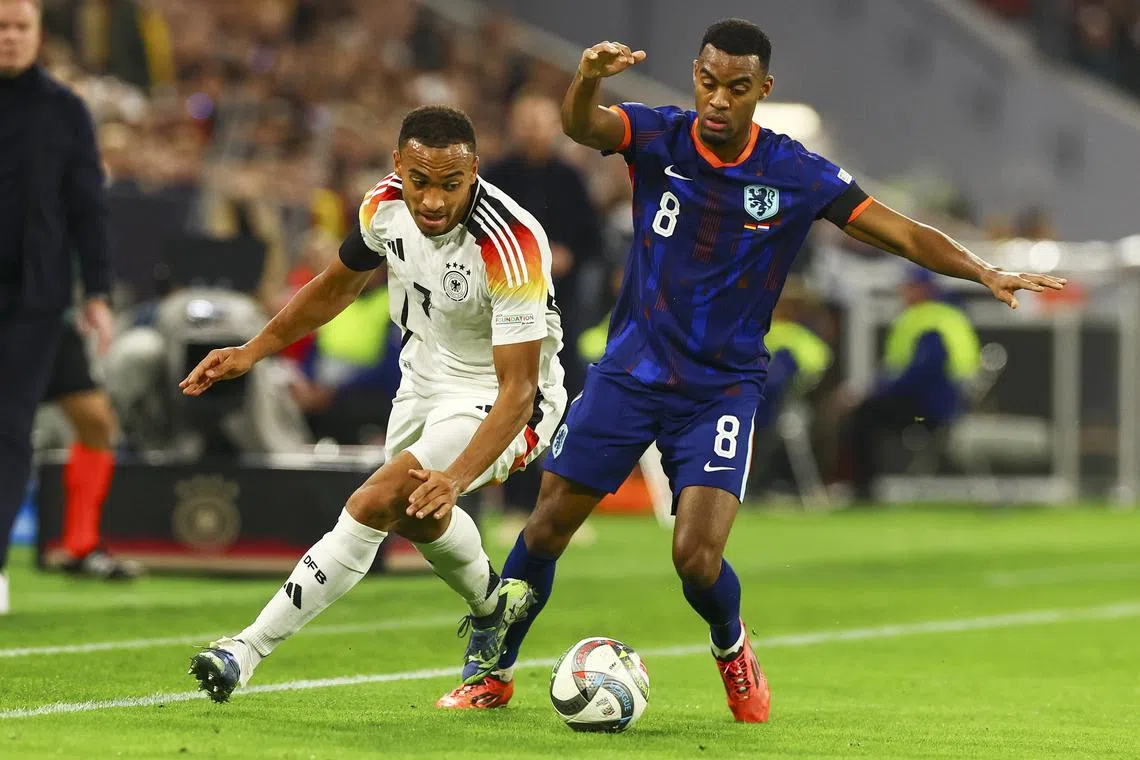 Jamie Leweling of Germany (left) in action against Ryan Gravenberch of Netherlands.