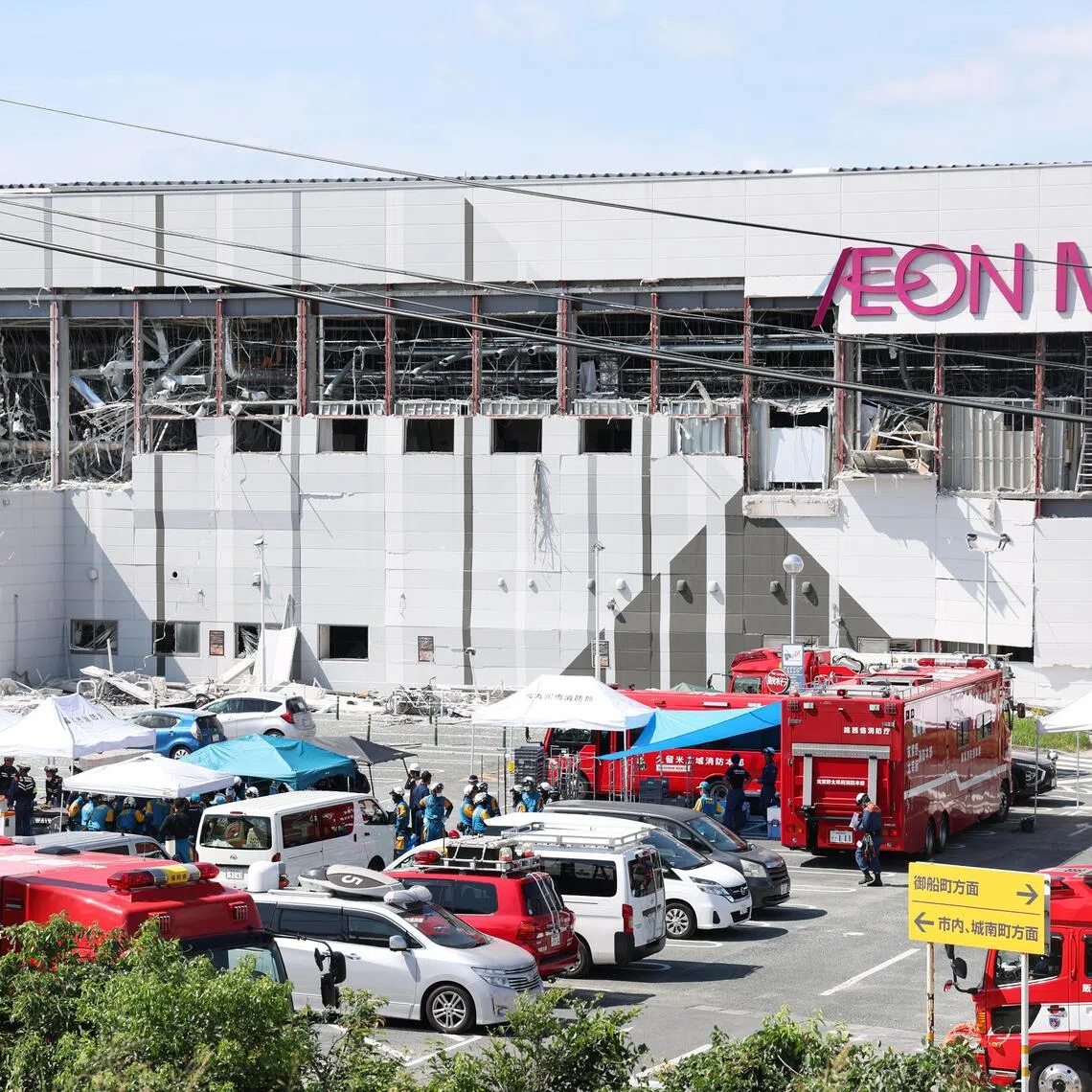 Rescuers conduct search operations at the Aeon Mall Kumamoto building which was damaged by an explosion following a powerful earthquake.