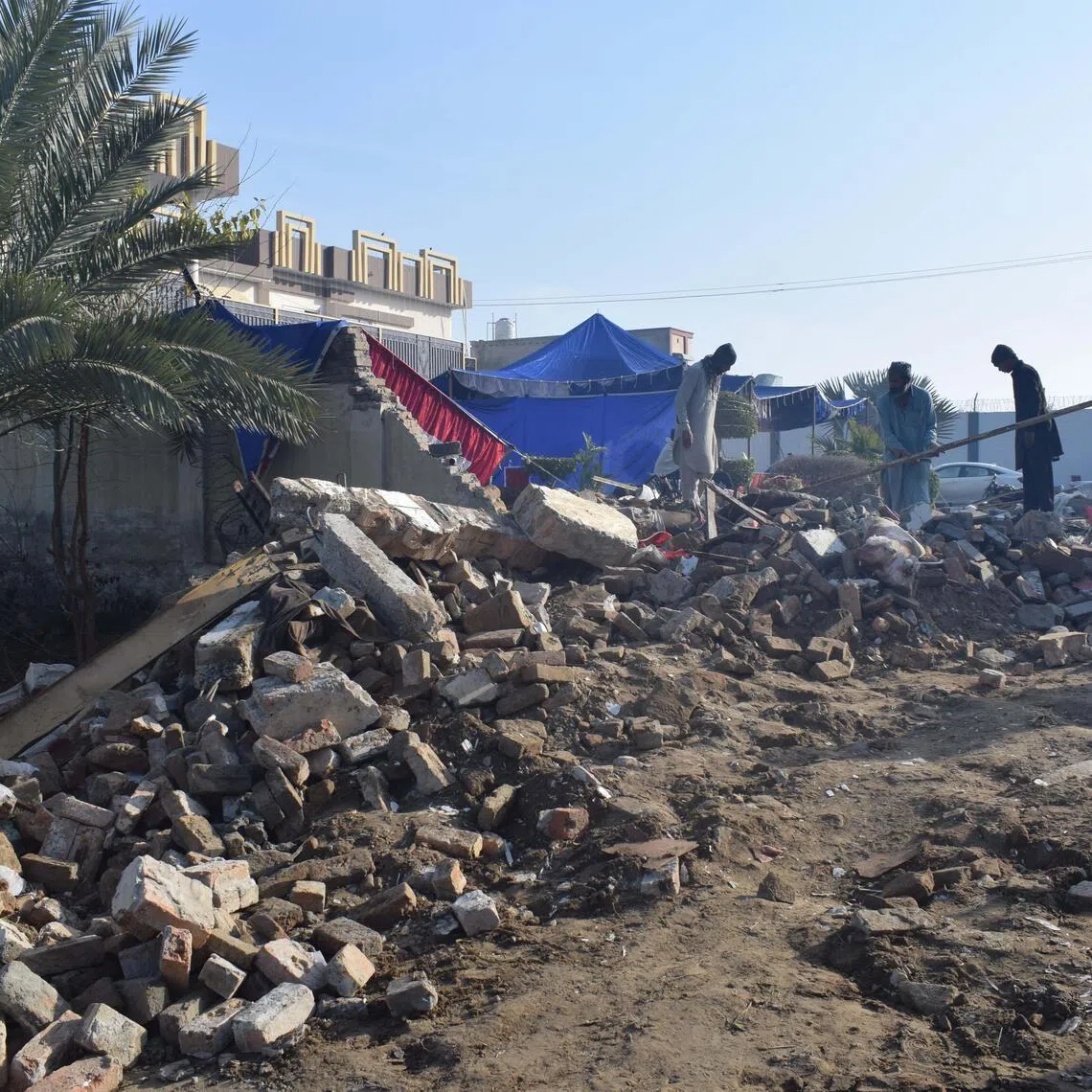 The explosion collapsed part of the house, hampering rescue efforts as authorities launched an investigation and provincial leaders condemned the attack.