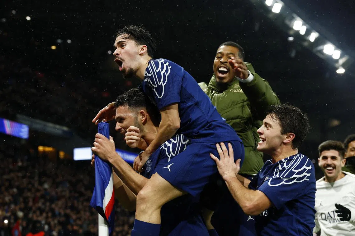 Paris St Germain's Goncalo Ramos celebrates scoring their fourth goal with Vitinha, Presnel Kimpembe and Joao Neves.