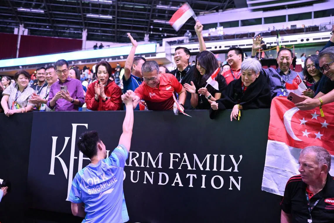 Law Minister Edwin Tong congratulating Loh Kean Yew on his victory in the men’s singles semi-final at the Singapore Open on May 30.