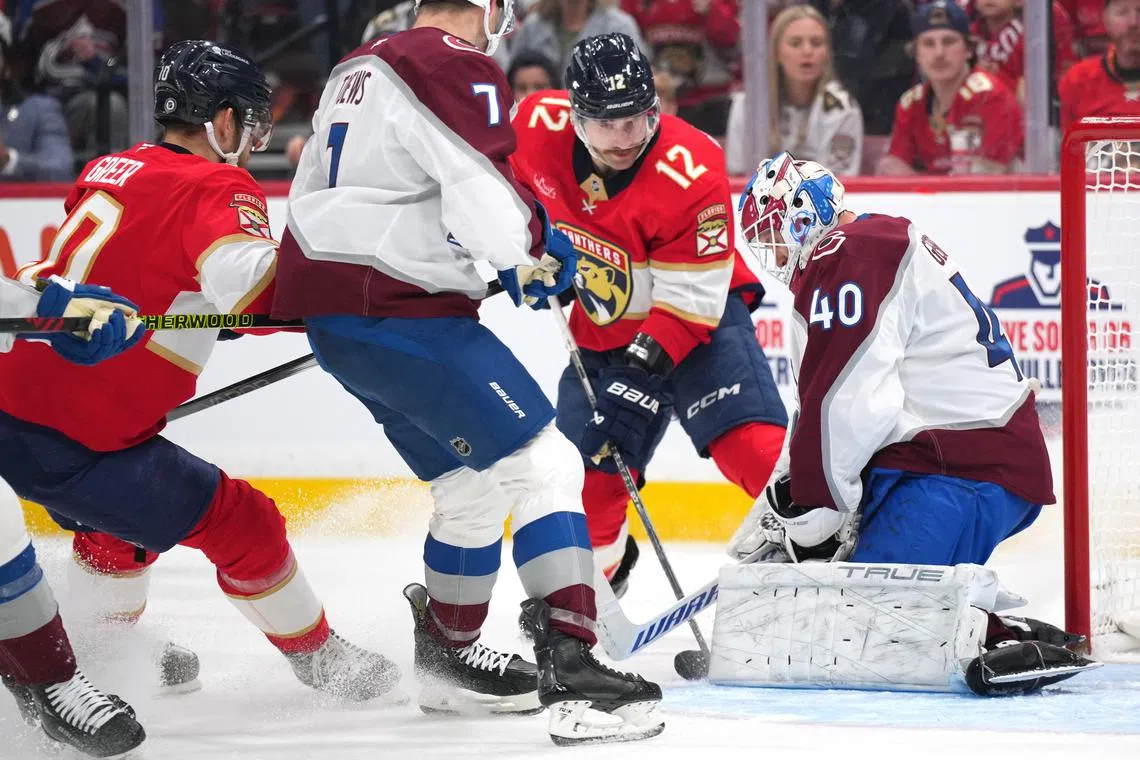 FILE PHOTO: Nov 23, 2024; Sunrise, Florida, USA;  Colorado Avalanche goaltender Alexandar Georgiev (40) makes a save as Florida Panthers left wing Jonah Gadjovich (12) closes in during the second period at Amerant Bank Arena. Jim Rassol-Imagn Images/File Photo