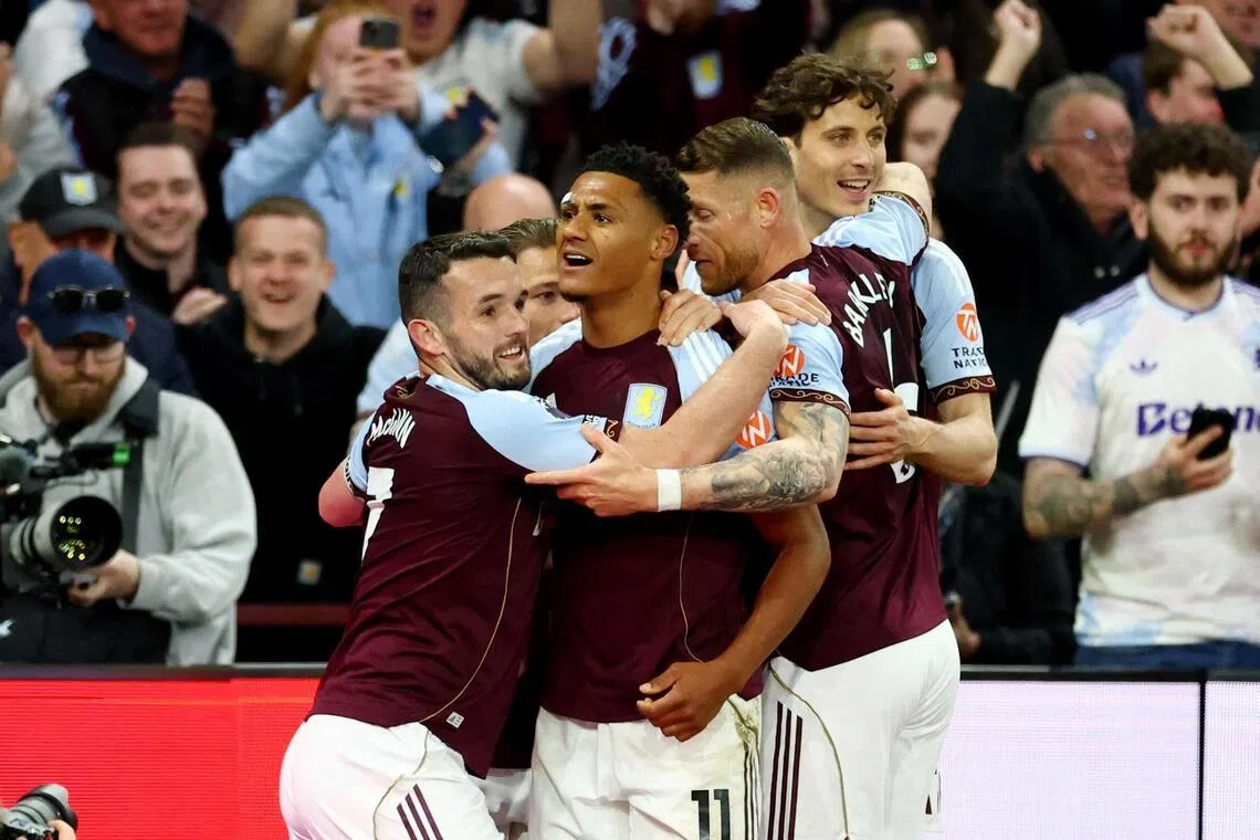 Aston Villa's Ollie Watkins celebrates scoring their third goal - his second of the match - with teammates.