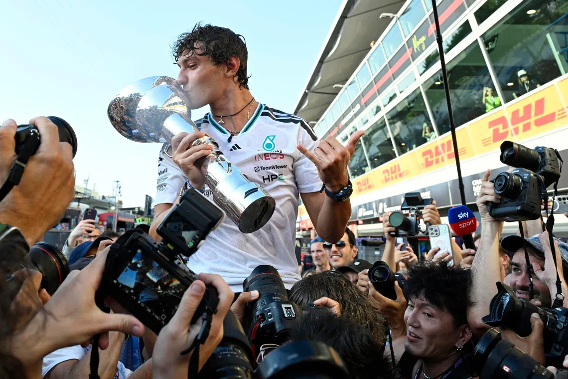 Mercedes driver Kimi Antonelli of Italy celebrates with the team winning the Formula One Grand Prix of Italy in Monza.